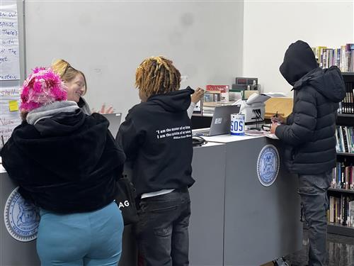 people in line at the SOS mobile unit in the hallway
